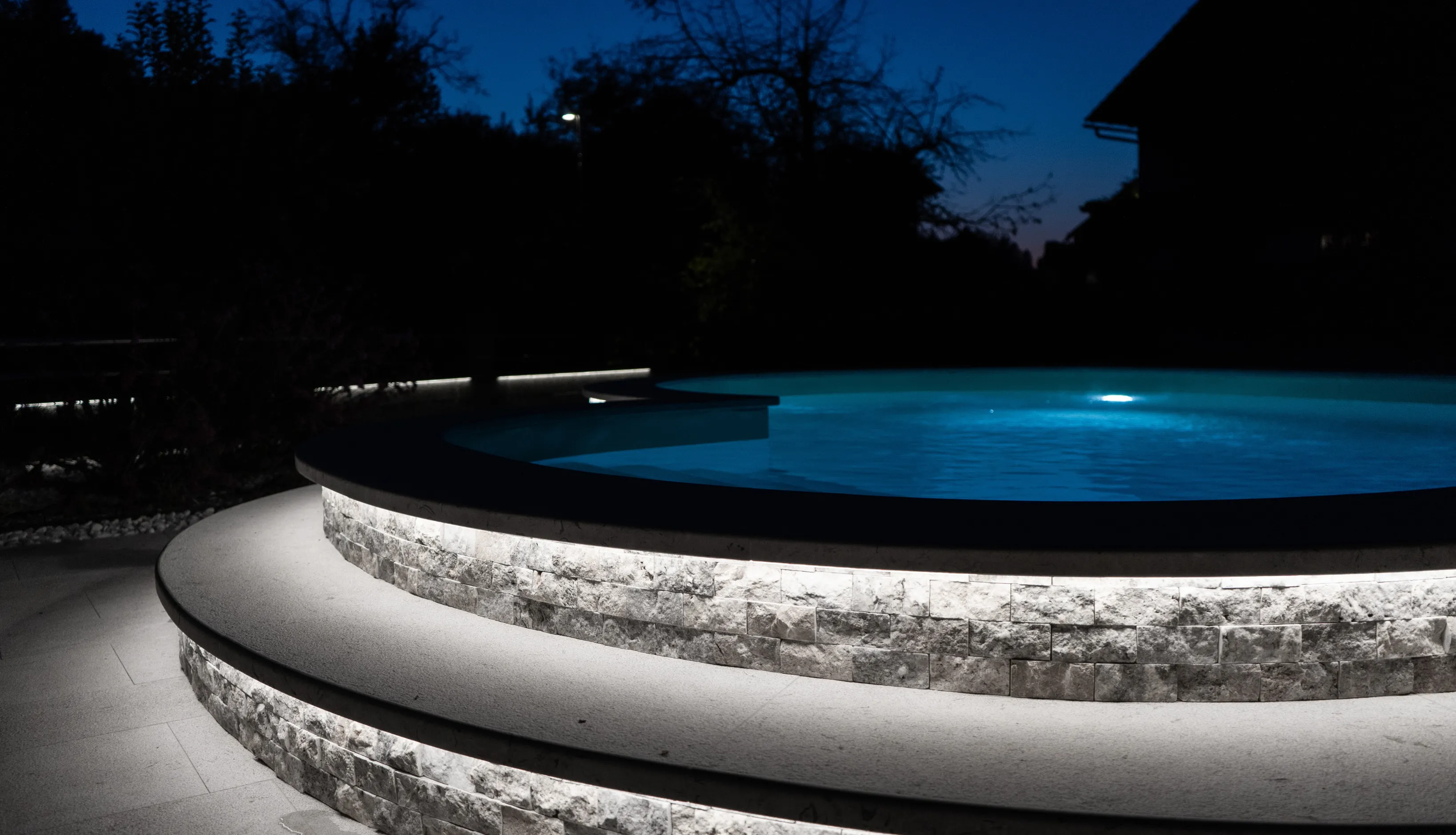 Contemporary blue tile lap pool design optimized for narrow backyard spaces in Southern California luxury homes